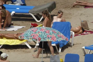 Girls on a nude beach in Sitges, Spain