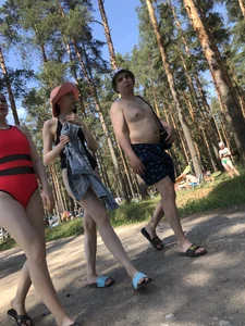 Young Girl in a One-Piece Swimsuit Walking on a Forest Road Photo Gallery