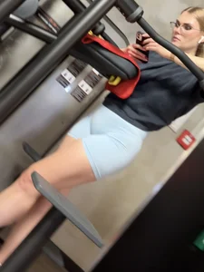 Hot blonde in gym just to show off her tight ass in blue shorts