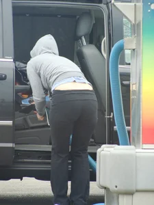 Girls cleaning their cars in jeans and pants