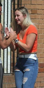 Blonde in skintight jeans shopping with boyfriend