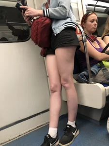 Hot Legs of a Candid Girl in Shorts Standing in a Subway Train Creepshots