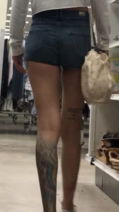 Slim tatted succubus in cheeky jean shorts