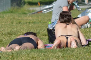 Girl Sunbathing in the City Park in Swimsuit Candid