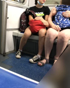Skinny Candid Teen's Legs in Shorts With Visible Leg Hair Subway Photo Gallery