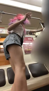 Girl With Pink Hair and Hot Legs in Denim Shorts in the Subway Train Candid Photo Gallery