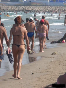 Bunch of sexy babes at the beach in thong bikinis