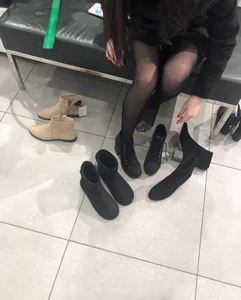 Candid teen wearing black pantyhose changing shoes creepshots