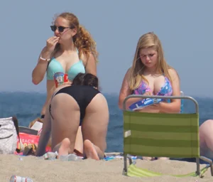 3 girls on the beach in bikinis with big boobs, one brunette and two blondes