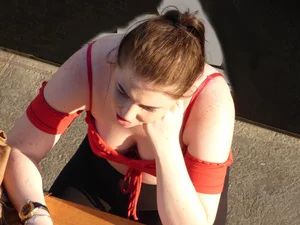 Redhead in little red top showing off her cleavage
