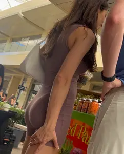 Brunette with tight and perky ass in brown one-piece (OC)