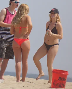 Sexy thick blonde girl with tiny bikini and big booty on the beach