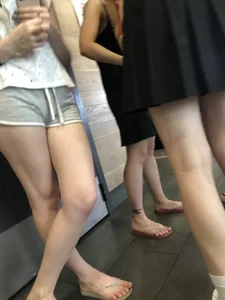 Hot Girl in Shorts And Slippers Standing With Crossed Legs Creepshots