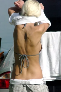 Blonde babe changing into and out of bikini and shows her tits