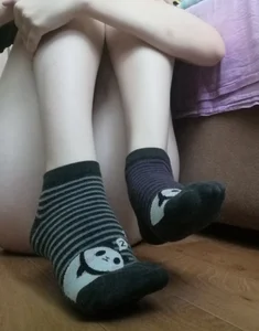 Legs with Pale Skin in Cute Socks Home Selfie