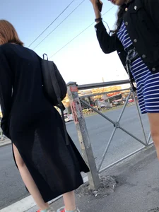 Teen wearing black dress which becomes transparent
