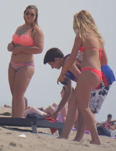 Sexy thick blonde girl with tiny bikini and big booty on the beach