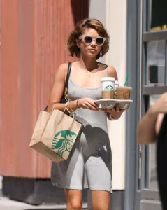 Sarah Hyland showing pokies while braless in a dress