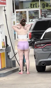 Milf with ass cheeks hanging out of her shorts at the gas station