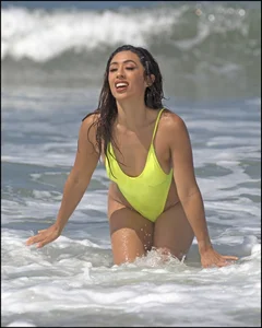 Sexy ass beach babe in a yellow thong swimsuit