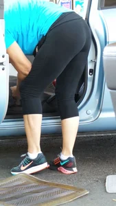 Girl in tight see through leggings with nice ass cleaning her car