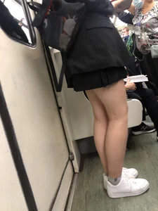 Cute Girl in a Mask With Sexy Legs Reading in a Subway Train Creepshots Gallery
