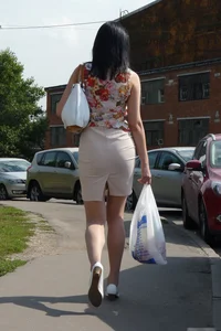 Milf in s Skirt and Pantyhose with a Bag of Groceries Street
