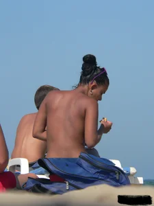 Hot ass topless beach girl with great tits lets her little brother oil up her ass in thong bikini