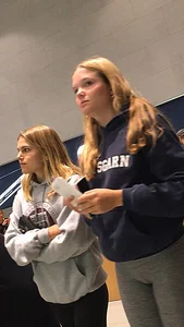 Blonde teen shopping at an Apple store in tight grey leggings