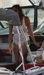 Bikini babe on a boat with a wet see through white shirt showing her tits