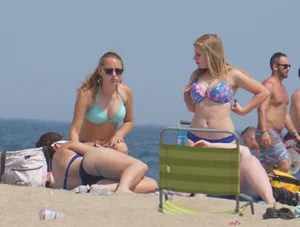 3 girls on the beach in bikinis with big boobs, one brunette and two blondes