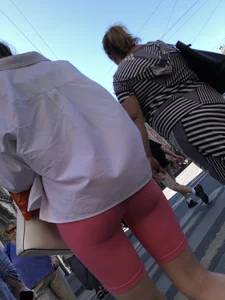 Awesome booty in spandex shorts, candid girl on a sidewalk