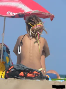 Sexy girls going topless at the beach showing off their sexy bodies