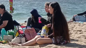 Beautiful Teen with Miniskirt resting on the beach