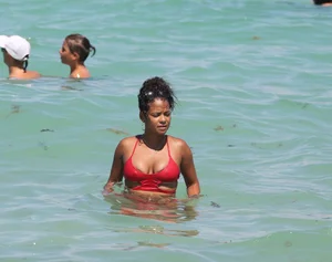 Christina Milian in red bikini in Miami with hard nipples