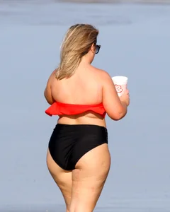 Thick BBW blonde lady in a bikini at the beach