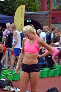 Sexy blonde track sprinter changing after a race