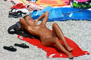 Ula FKK Sexy brunette on a nude beach topless, bottomless and with blue thong