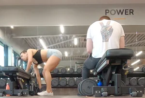 Gym brunette in tight grey shorts bending over, part 3