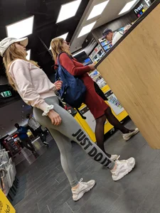 Book store beautiful babe in tight grey Nike leggings