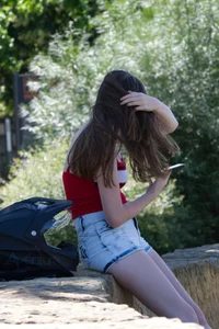 Pretty candid girls with nice legs sitting in denim shorts