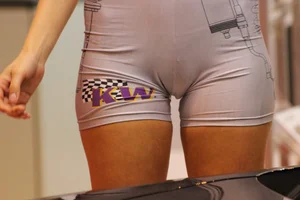Car show models in spandex short suits with cleavage and camel toe