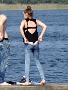 Girl on the water in black thong bikini with a nice ass