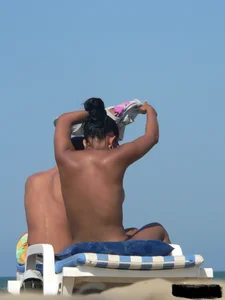 Hot ass topless beach girl with great tits lets her little brother oil up her ass in thong bikini