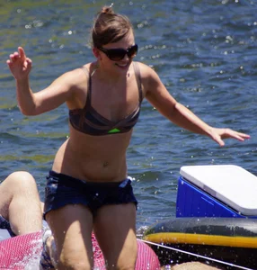 Sexy party girls in bikinis on a lake