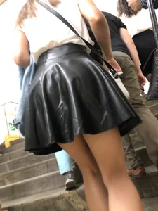 Awesome Candid Girl in a Leather Skirt And Sneakers Walking Down a Street, Then Flashing Her White Panties on the Stairs Creepshots Gallery