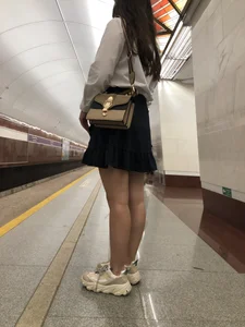 Girl in a Blouse And a Skirt With Great Legs Creepshots Gallery - Standing on the Subway Station, then Sitting With Crossed Legs in a Train