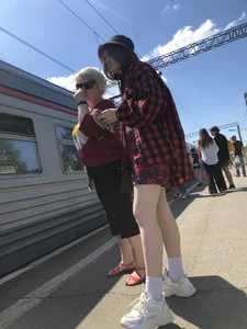 Cute candid teen on a train platform