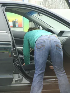 Girls cleaning their cars in jeans and pants