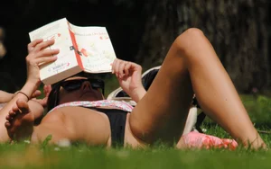 Sexy milf getting some sun in a bikini at the park
